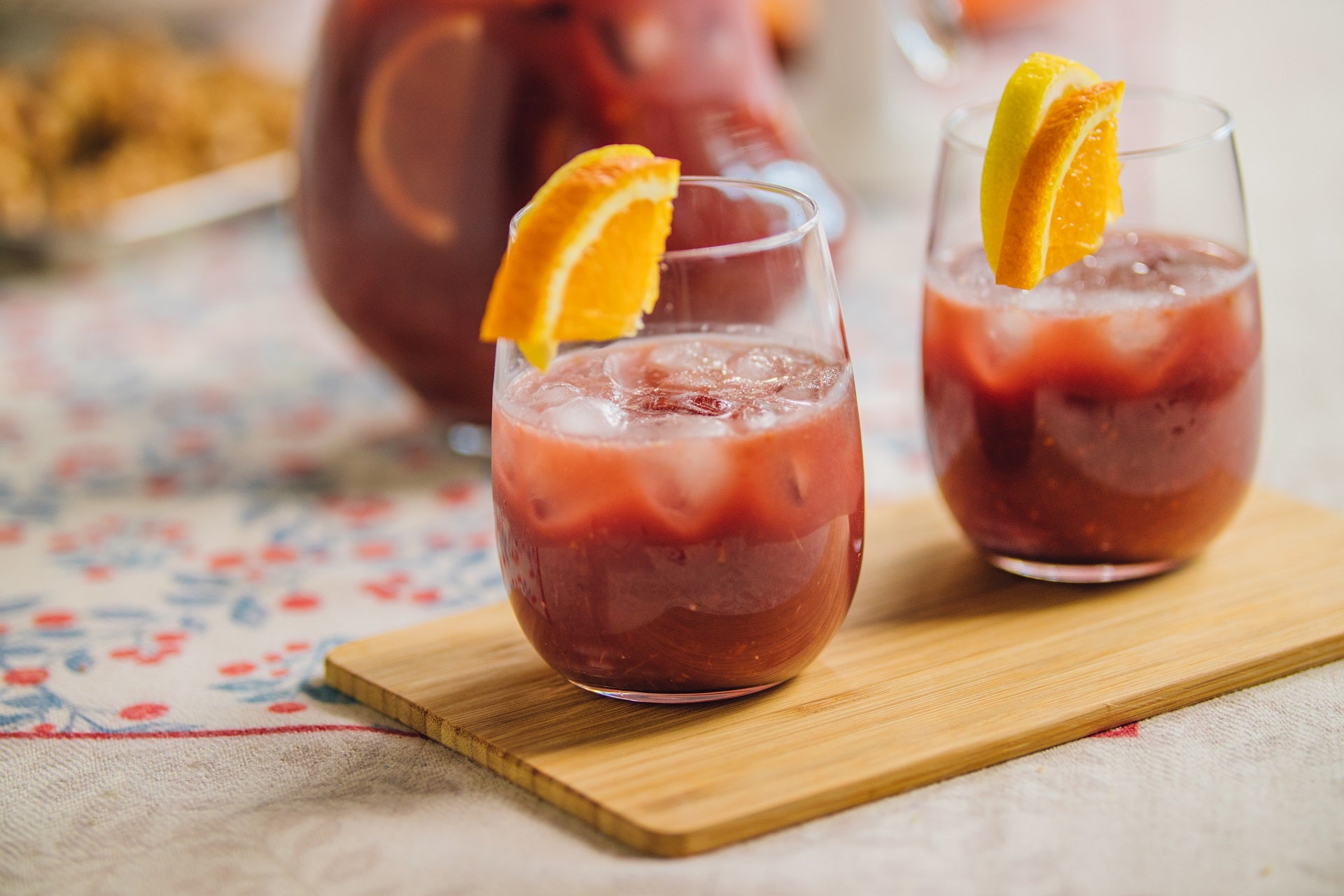 two cups of Sangria with orange wedges